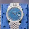 Rolex Datejust 41 126300 azzurro blue Roman dial front view on blue ostrich pillow showing smooth bezel and Jubilee bracelet
