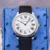 Cartier Ronde Must WSRN0031 white Roman dial front view showing blue steel sword hands black leather strap and blue cabochon crown