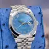 Rolex Datejust 41 126300 angled view on blue pillow showing azzurro blue Roman dial with date cyclops and smooth bezel