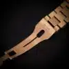Rolex Day-Date 36 18K yellow gold President bracelet full length draped over blue ostrich pillow on display stand
