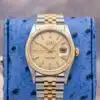 Rolex Datejust 36 16233 champagne dial front view showing two-tone yellow gold fluted bezel and Jubilee bracelet with date window