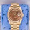 Rolex Day-Date 36 18038 walnut burl wood dial front view on blue ostrich leather pillow showing day-date complication and fluted bezel